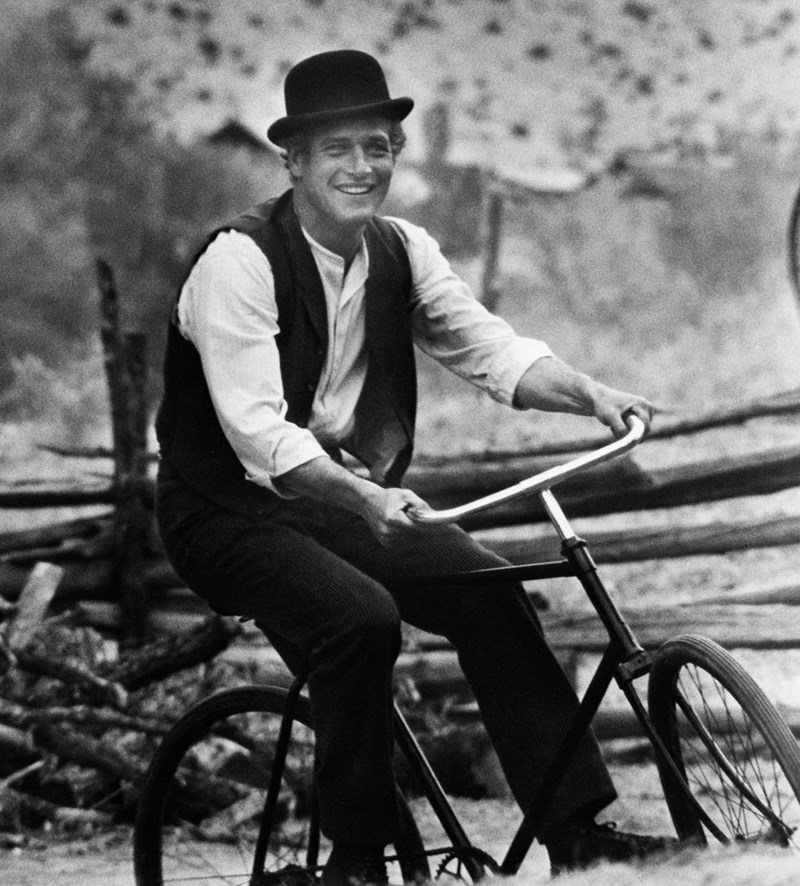 PAUL NEWMAN BIKING A BICYCLE