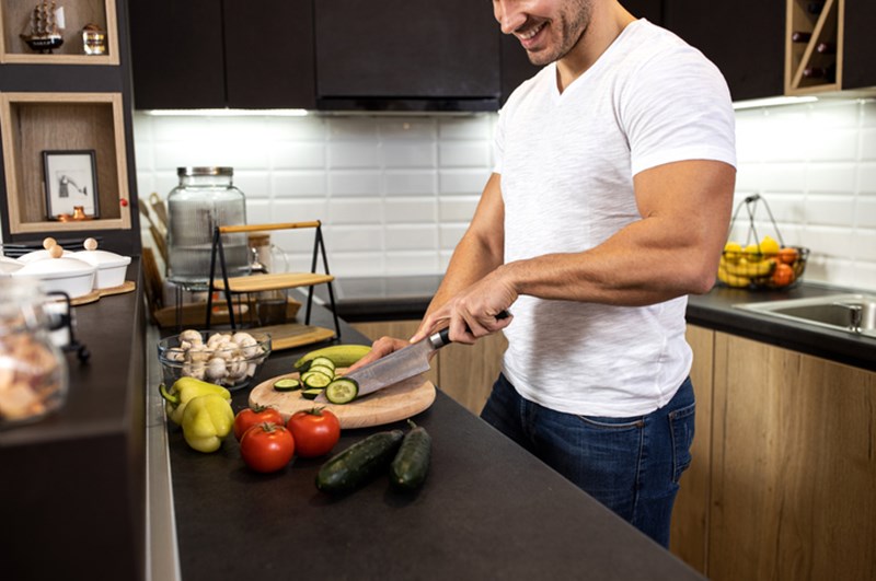 MAN PREPARING A MEAL