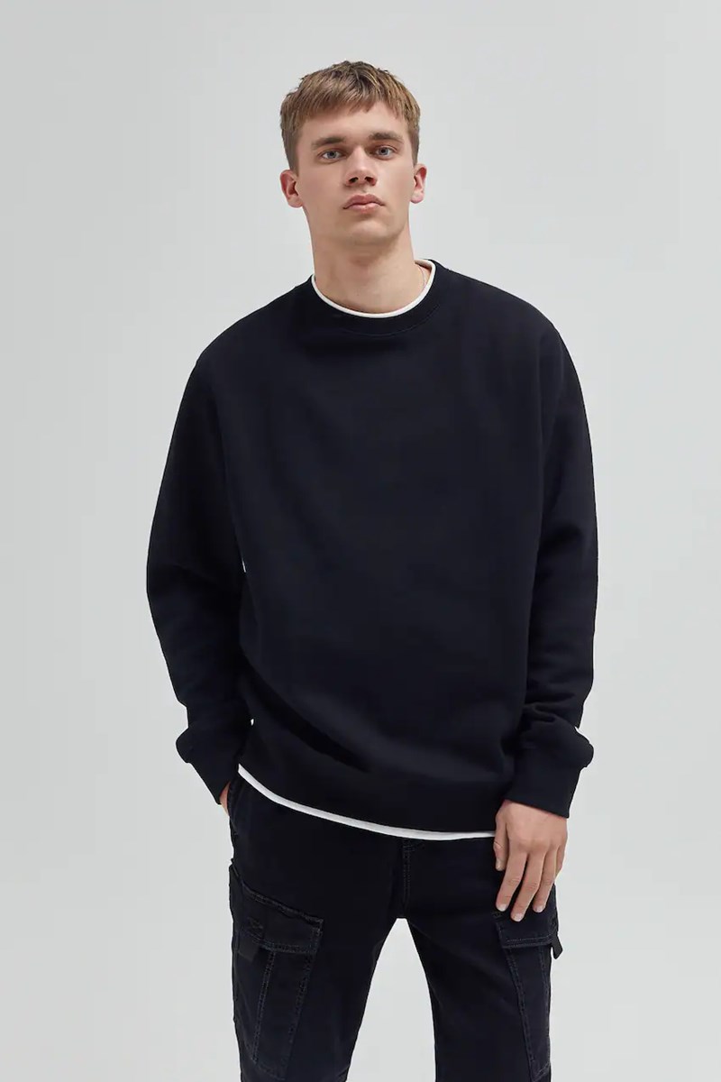 MODEL WEARING A PULL & BEAR SWEATER