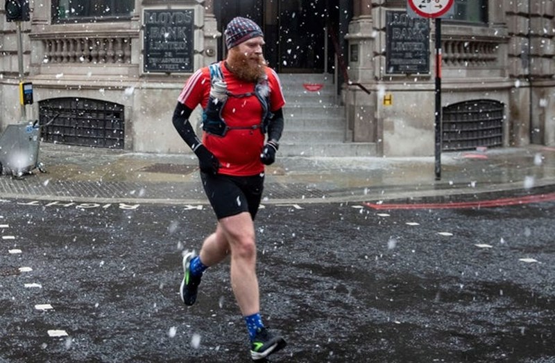 MAN JOGGING IN THE SNOW