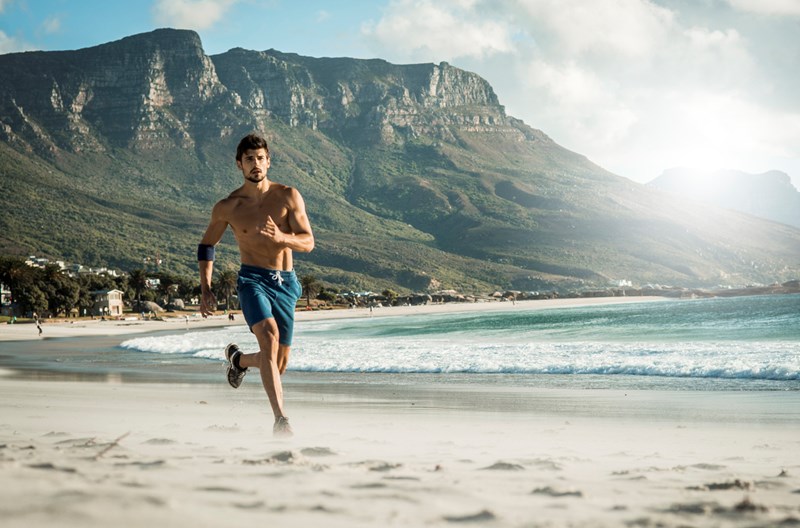 MAN RUNNING ON THE BEACH