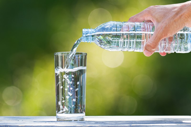 POURING WATER INTO A GLASS