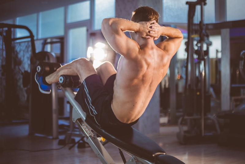MAN EXERCISING IN THE GYM
